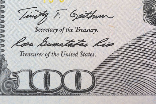A closeup of a 100 American dollar banknote