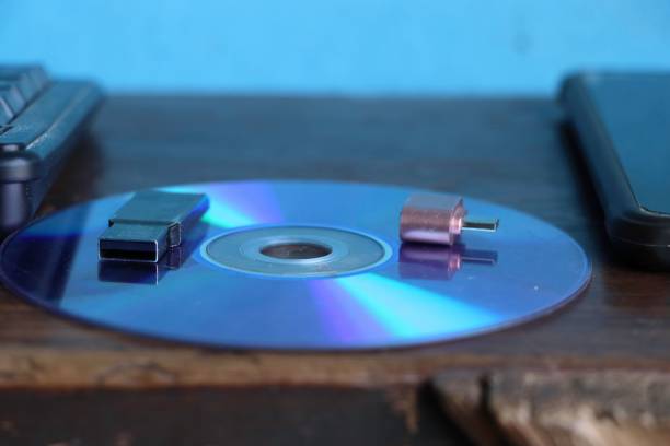 istock Closeup of a usb flash drives on a disc against a blue light. 1446425288
