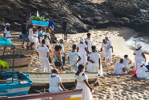 Salvador, Brazil – December 13, 2021: Faithful of the Candomble religion are taking gifts to the queen. Salvador, Brazil.