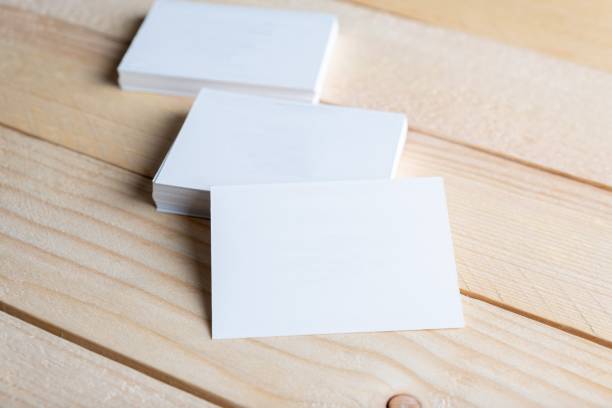 istock Closeup of blank white small note papers on the wooden surface. 1446426039