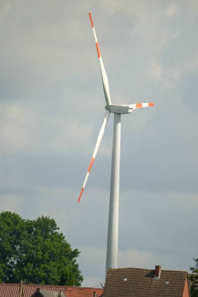 istock Vertical closeup of a red and white windmills 1446426177