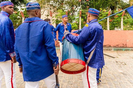 Saubara, Bahia, Brazil - August 03, 2019: Members of Marujadas groups play percussion instruments at the Cheganças meeting in Saubara, Bahia.
