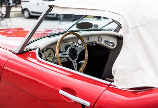 istock Red retro car's inside. Woodened wheel. Old tymer inside. 1446427083