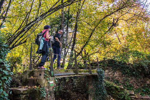 Hiking Couple In The Forest Are Contemplating Nature. Outdoor activities