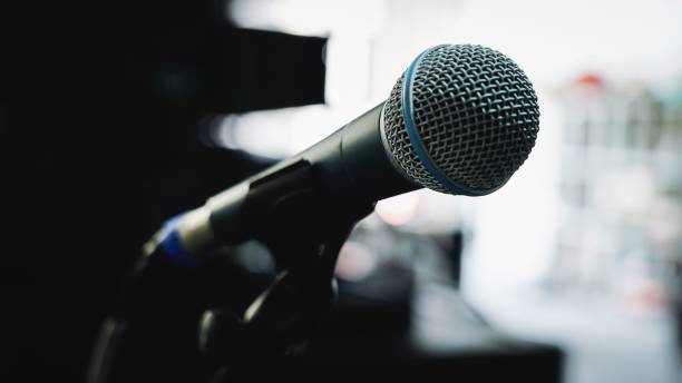 istock Selective focus of a microphone on the stand with blurred background 1446427880