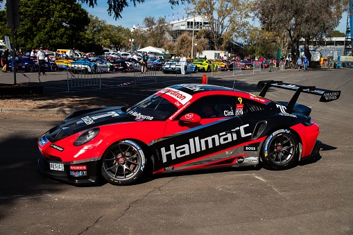 Melbourne, Australia – April 10, 2022: Red Hallmarc Porsche Carrera down at Albert Park Track for the Carrera Cup as all the colorful cars come down to the track and get ready to race.