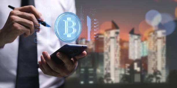 istock Person presenting a virtual projection of the cryptocurrency symbol 1446428770
