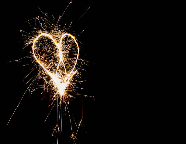 istock Hearts on a dark background drawn by a sparkler. 1446429733