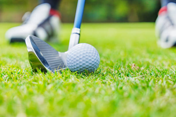 istock Golf course with beautiful lawn, ball and golf club 1446442825