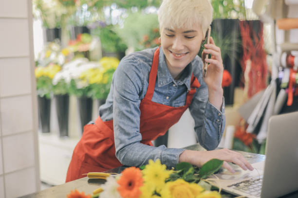 istock Female flower shop owner 1446444092