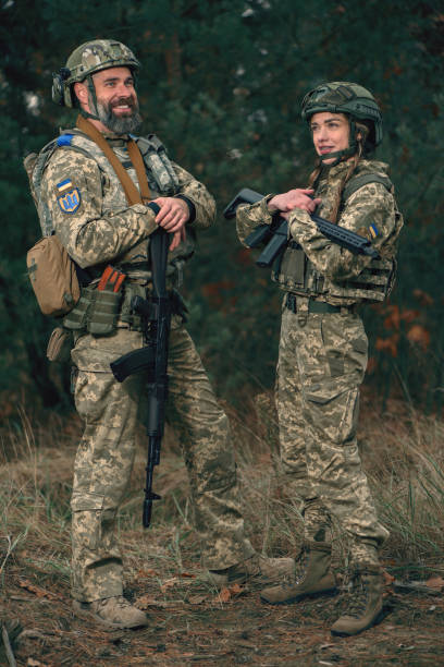 istock Smiling ukrainian soldiers dressed military uniform on combat duty. 1446445350