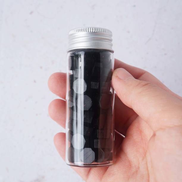 istock Wax bead in glass bottle 1446446196