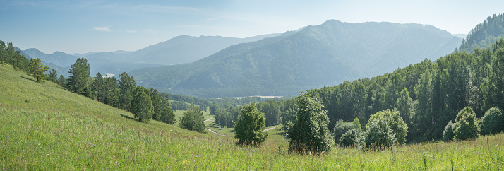 Mountain landscape, soft morning light, panoramic view