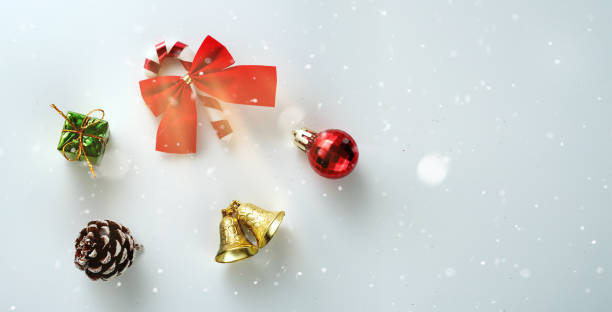 istock Christmas ribbon cane pine cone bauble gift bell shine on white flat lay background 1446447481