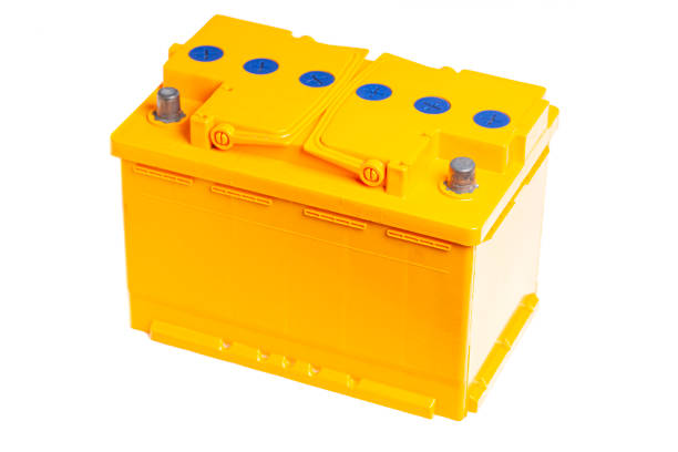 istock yellow car battery isolated on white background. 1446449229