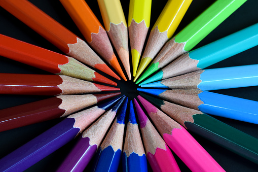 Color pencils isolated on black background. Close up shoot