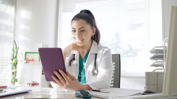 istock Young female doctor video conferencing 1446451649