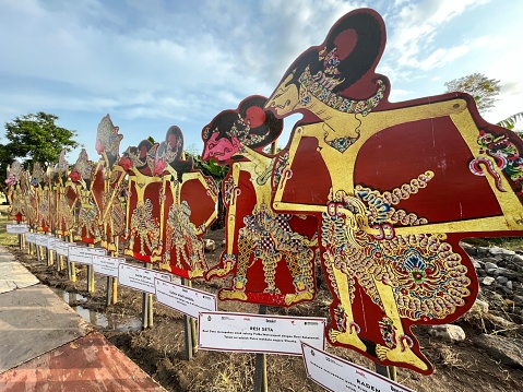 Yogyakarta, Indonesia - December 3, 2022: Set of Wayang Kulit with many characters being displayed around a local culture festival.