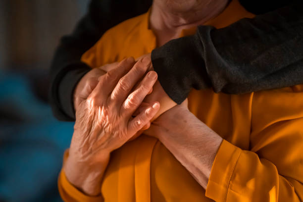 istock Man support his old grandmother, holds her hands. 1446454552
