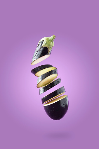 Creative photos of eggplant on a purple background