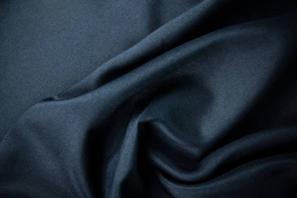 istock dark narvy blue Texture wallpaper and fabric background template design, modern Silk or fabric blue, Blue silk drapery and Solid fabrics for banner of fashion concrpts. 1446457168