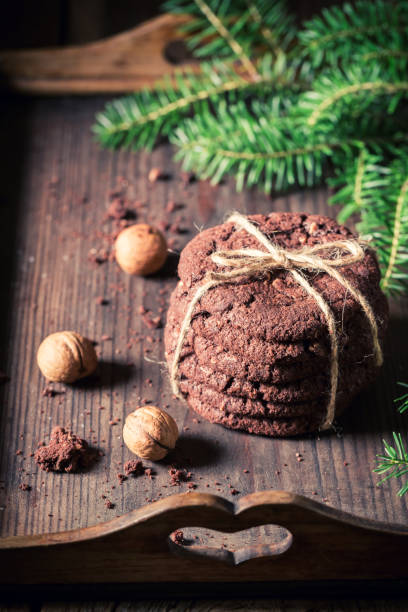 istock Sweet and homemade chocolate cookies on rustic style. 1446457312
