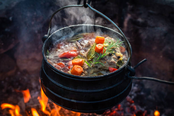 istock Delicious and hot hunter's stew on bonfire. 1446457446