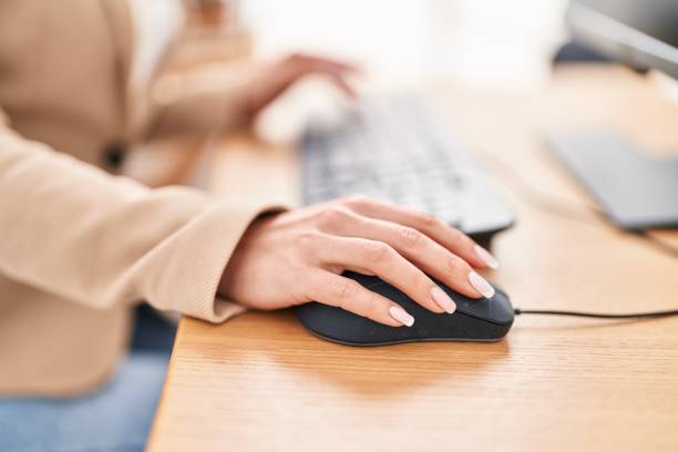 istock Young blonde woman business worker using keyboard and mouse at office 1446458622