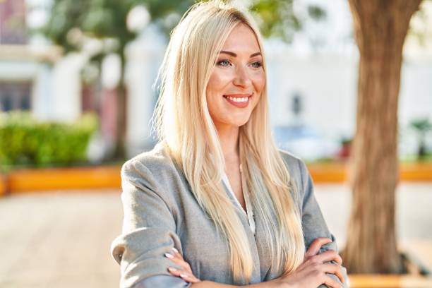 istock Young blonde woman smiling confident standing at park 1446458645