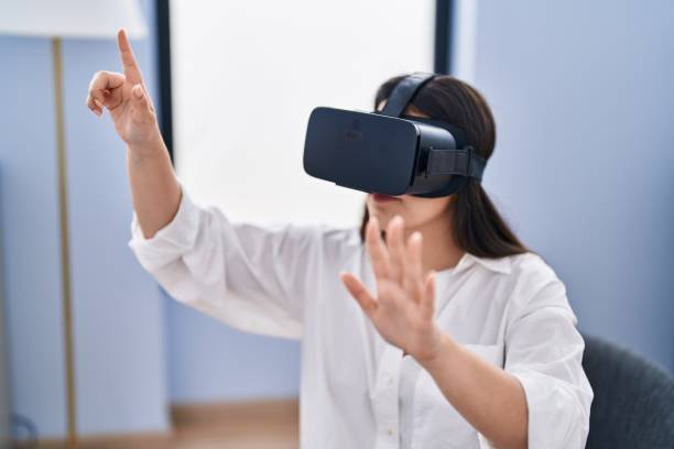 istock Young hispanic woman business worker using virtual reality glasses at office 1446458705