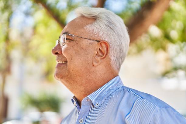 istock Senior man smiling confident standing at park 1446459936