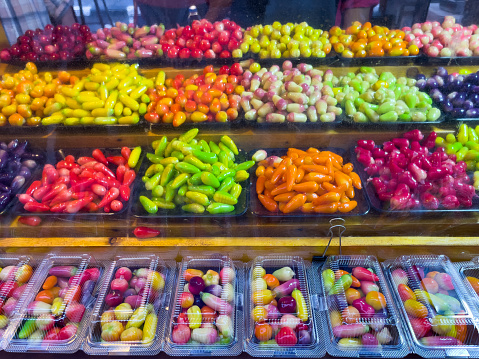 Traditional Thai candies at food market stall. Colorful sweets variety, sugar, unhealthy diet concepts