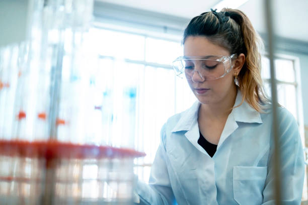 istock Woman working in a lab. 1446464093