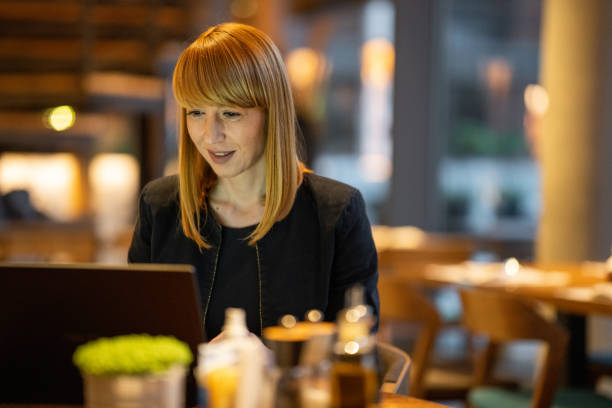 istock Restaurant owner working on laptop in the evening 1446464145