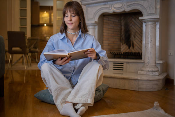 istock Woman relaxing and reading a book 1446465723