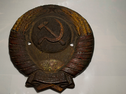Close-up of the coat of arms of the USSR on a white background. High quality photo