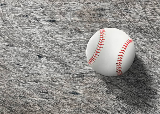 istock Baseball on wooden board turf close-up. Top view 1446467523
