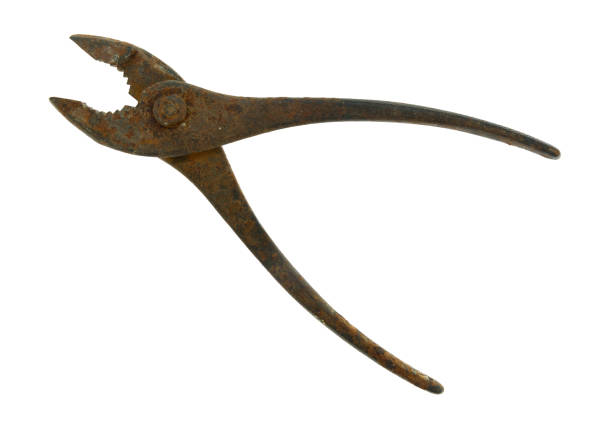 Top view of an old pair of rusty and used pliers isolated on a white background.