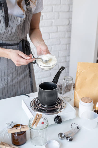istock Woman making decorative aroma candle at table, closeup 1446469532