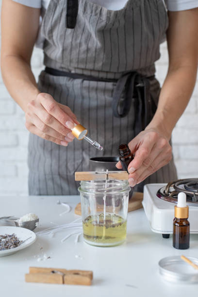 istock Woman making decorative aroma candle at table, closeup 1446470120