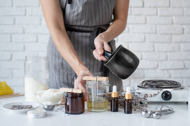 istock Woman making decorative aroma candle at table, closeup 1446470152