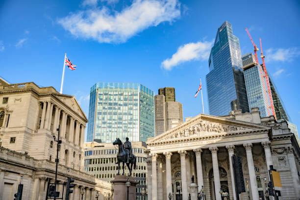 Financial District, City of London Low angle view of Bank of England, Royal Exchange, and Duke of Wellington equestrian statue (1844) with skyscrapers and construction in background. city of london flag stock pictures, royalty-free photos & images