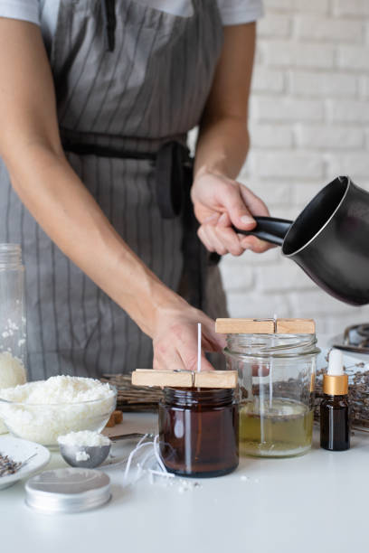 istock Woman making decorative aroma candle at table, closeup 1446470177