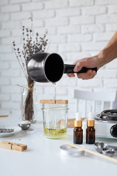 istock Woman making decorative aroma candle at table, closeup 1446470656