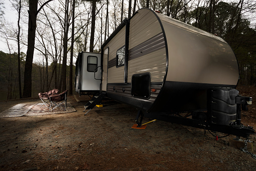 Camping trailer and chairs out front at Jordan Lake North Carolina in early spring