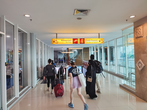 Bali-Indonesia, 28/11/2022 : Passengers arriving at I Gusti Ngurah Rai International Airport in Bali