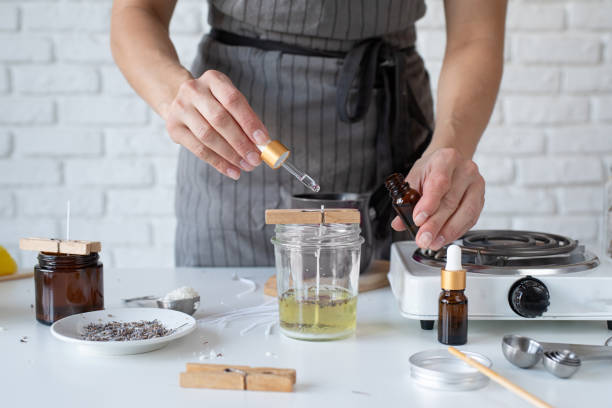 istock Woman making decorative aroma candle at table, closeup 1446470945
