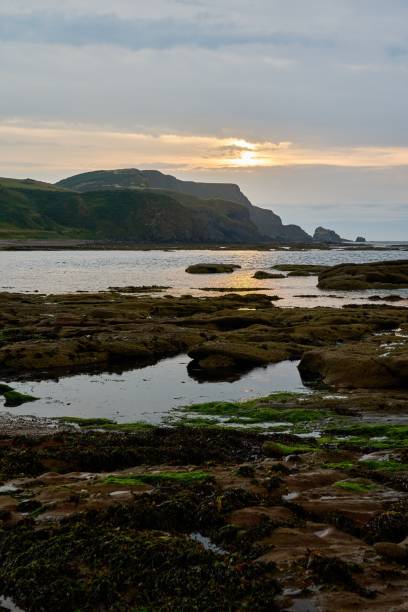 istock sunset over the bay of Aberdour bay and its cliffs 1446471622
