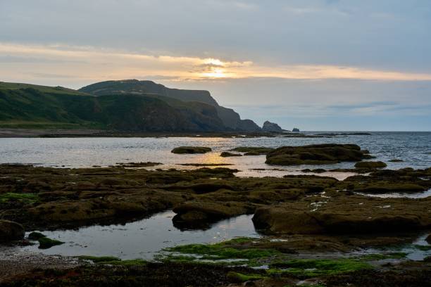 istock sunset over the bay of Aberdour bay and its cliffs 1446471656
