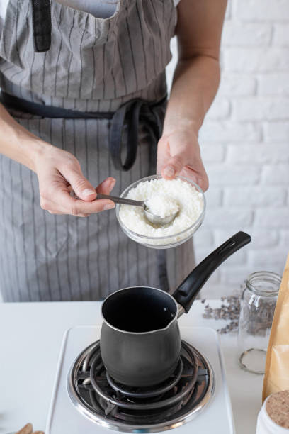istock Woman making decorative aroma candle at table, closeup 1446471834